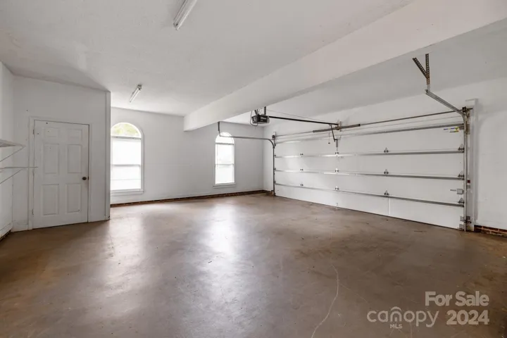 Large garage with extra storage or workshop