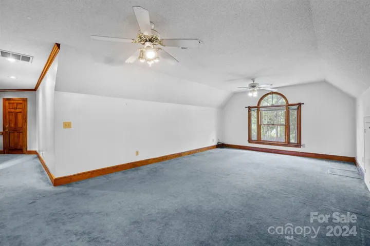 Large bonus room above garage could be converted to a 4th bedroom with addition of a closet and door.