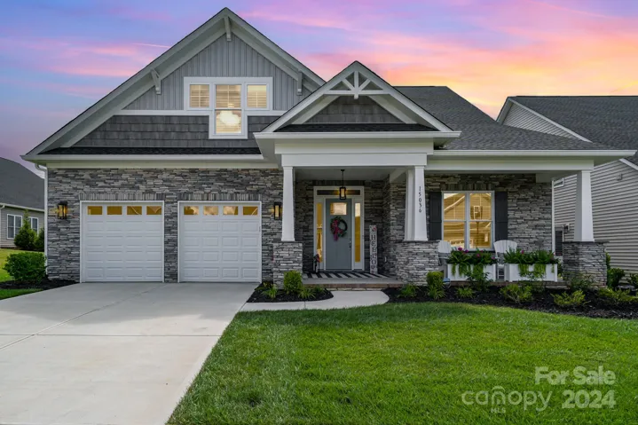 Beautiful Home in The Forest packed with features. Custom elevation with brackets, stonework and custom window arrangements