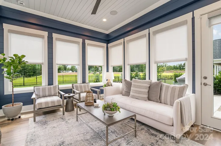 Just off the breakfast room is a fantastic sunroom with a stone fireplace and windows everywhere. This wonderful addition is the perfect spot to relax