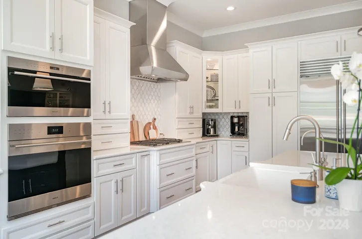 Custom cut glass shelves allow the corner cabinet to shine!