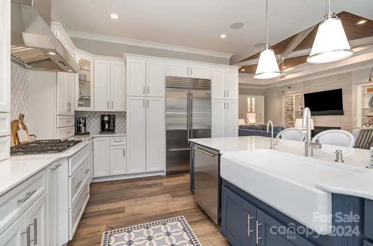 Large pantry cabinets with roll-outs and plenty of cabinet and counter space for all of your cooking or entertaining needs