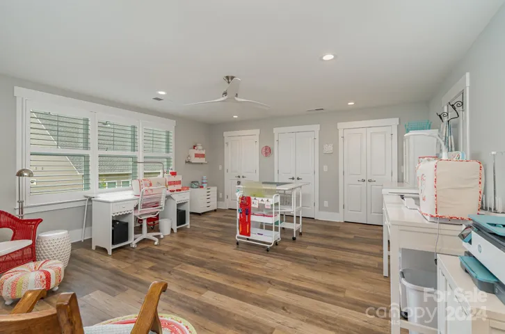 Upstairs opens to an incredible bonus room / craft room. So many possibilities with closets galore for all of your hobbies. In addition to the amazing closet space, there are extra large spaces in the walk-in attic. Plenty of room for everything!