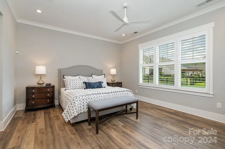 Large Primary on the main with large windows and lovely trim work which frames the rear windows