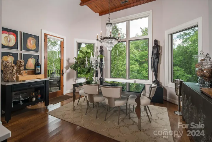 Breakfast area with a view of the fire pit and access to large deck