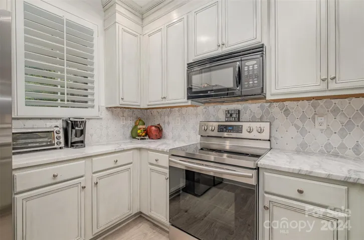 Ample cupboard space with built-in microwave