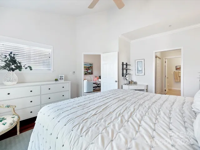 Primary Bedroom with small window opening to terrace