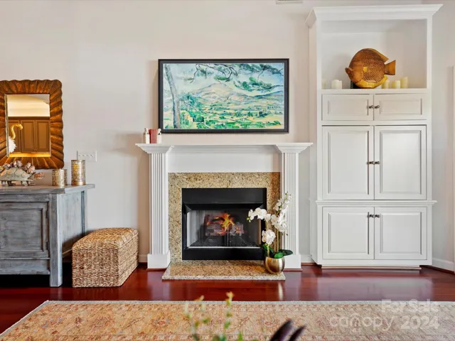 Living Room wall with fireplace and built in cabinetry