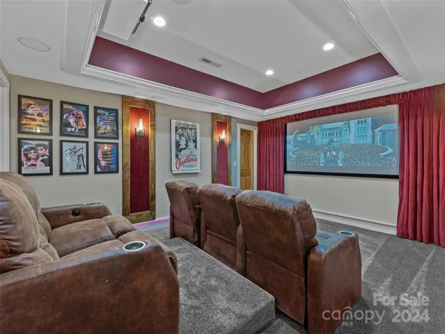 Theater Room With Custom Lighting Controls and Built-In Surround Sound