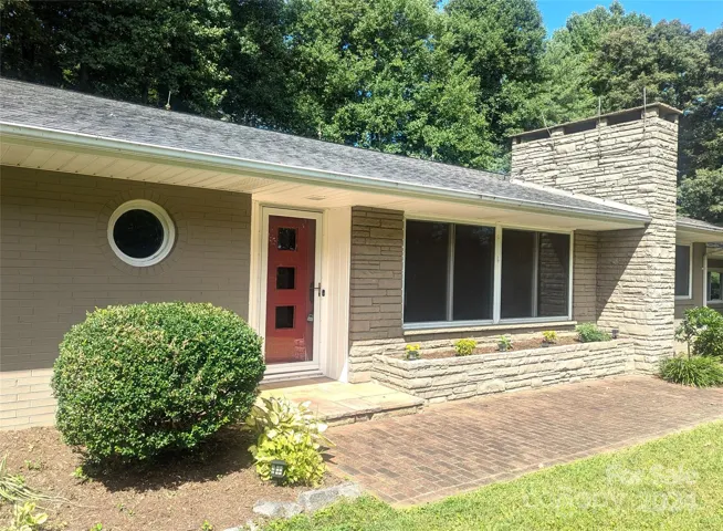 Front door entrance area and brick sidewalk