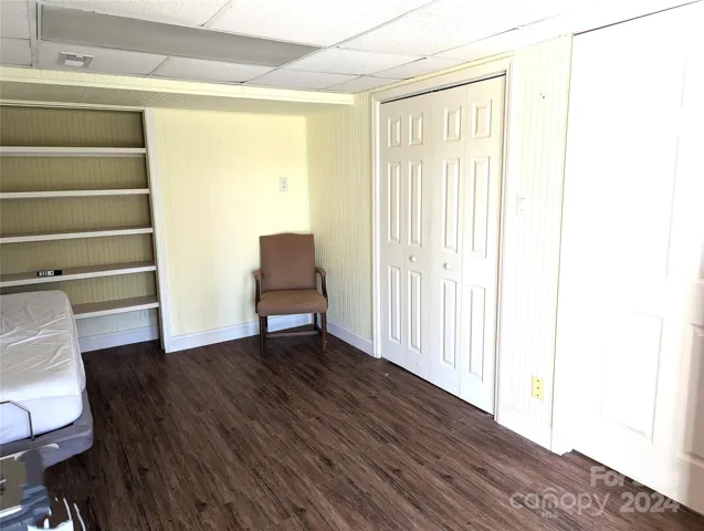 Finished basement room. Egress by patio doors to lower driveway.