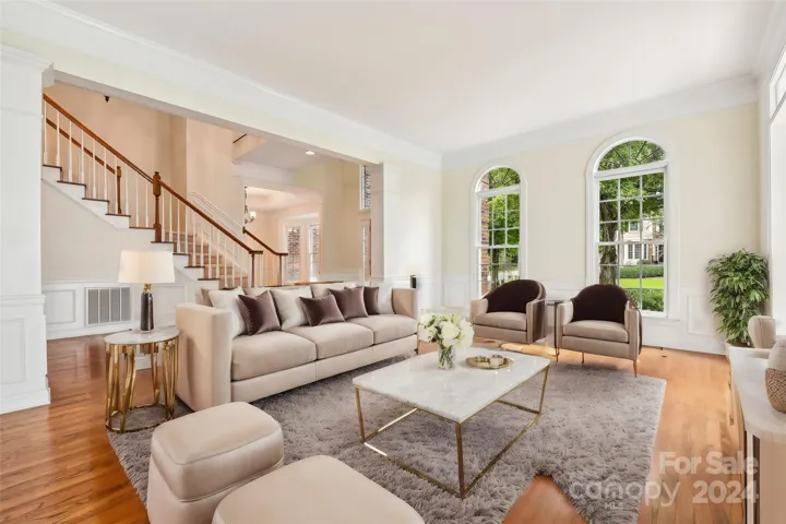 Virtually staged large formal living room.