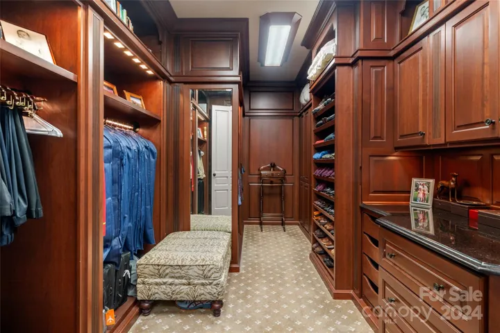 Custom Built-ins and Granite in His and Hers closets