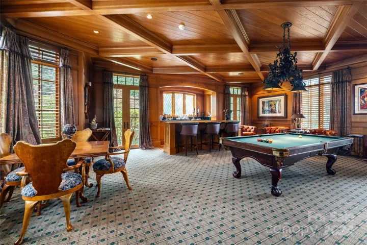 Billards Room with custom wood work with diamond coffered ceiling and full Bar on Main Level