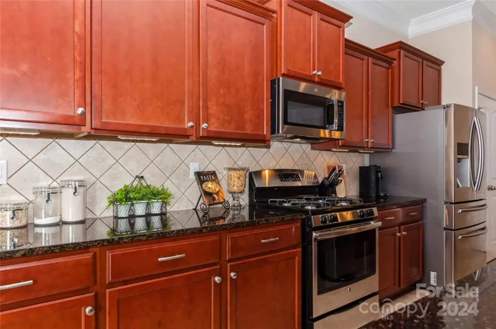 Kitchen with stainless steel appliances including Gas range, Microwave and Dishwasher