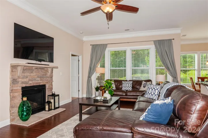 Living Room with stacked stone gas fireplace and mantle