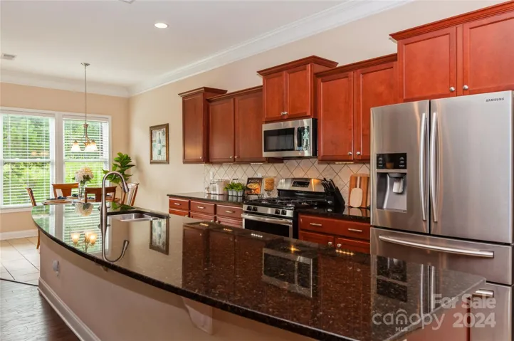 Kitchen opens to the breakfast area with tile tile floors