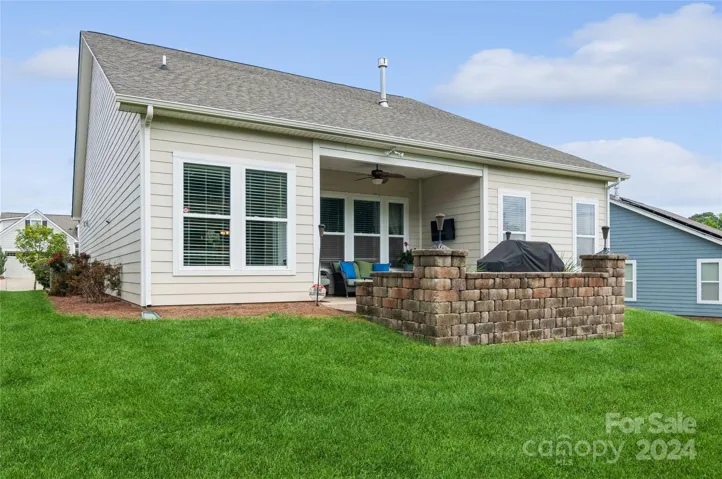 Back view of home and Stone Patio
