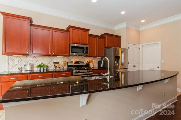 Large kitchen with huge granite island