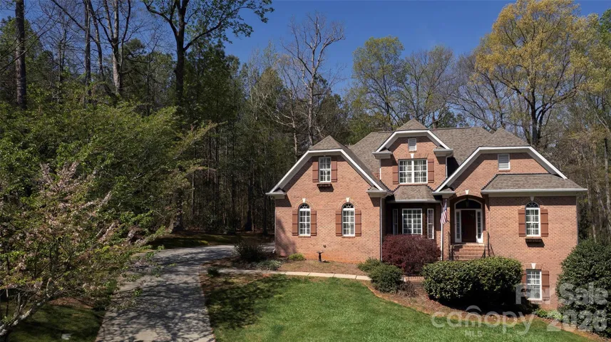 All brick 1.5 story (primary BR/ensuite bath main level), 4 BR,3.5BA AND finished daylight basement with 10 FT CEILINGS, stone fp, flex rm, BR 4/full BA.  Side entry oversized garage with 18' door!.  Entertain outside - 29 FT DECK, patio w/round brick firepit - all on PRIVATE TREED lg lot that adjoins the Treed HF Common area.
