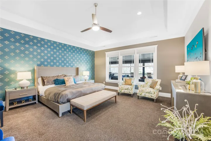 Primary bedroom with view of lake