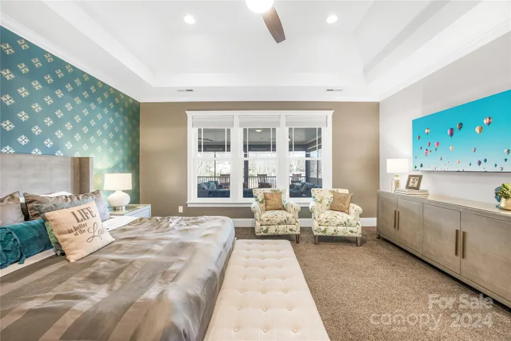 Primary bedroom with view of lake