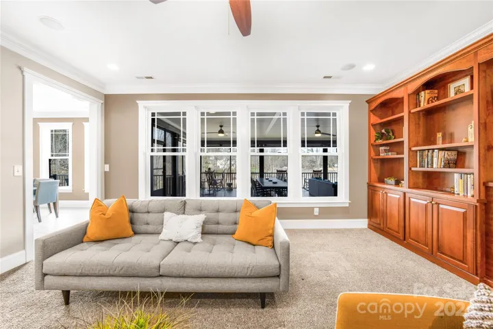 Family room with view of lake through screened porch
