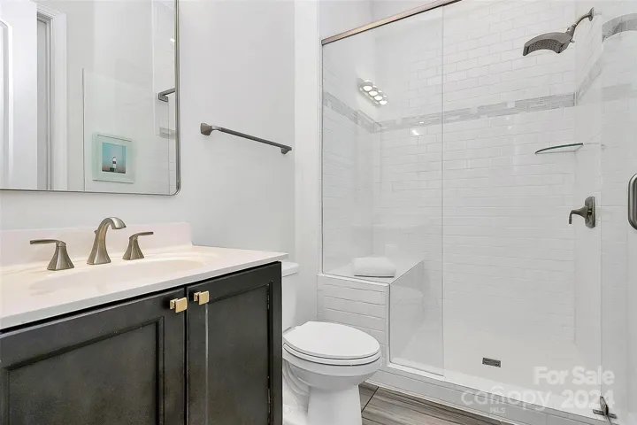 Full bathroom for guest access connected to guest room and hall.