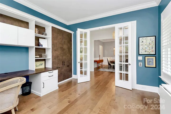 Work from home in this stylish office with California Closets textured leathered cabinetry & work top.