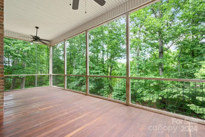 Great sitting area on this  Brazilian teak  wood deck covered and screened in.   size of deck 27'x12'