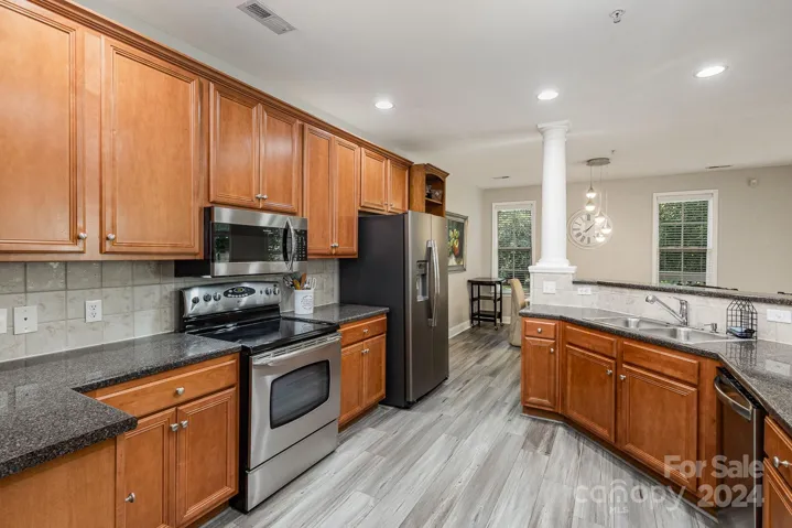 Large kitchen with stainless steel appliances