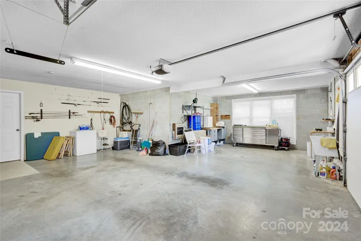 oversized two car attached garage with work shop area