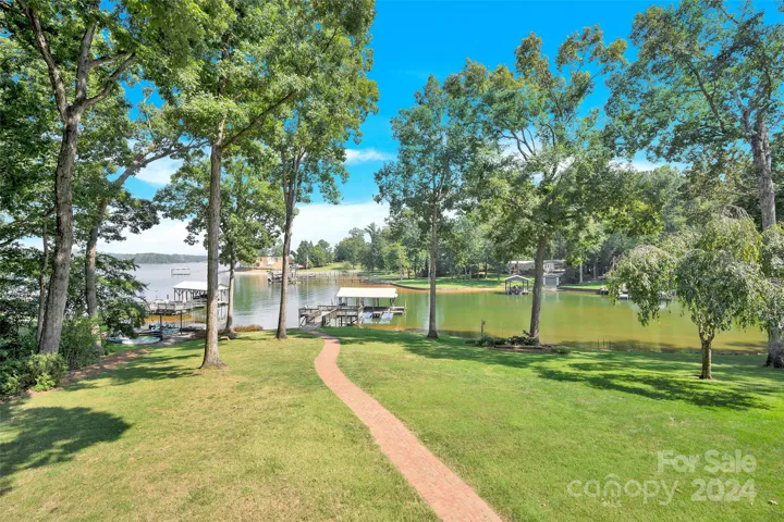 view from back wrap around porch to deck, slip, and main channel