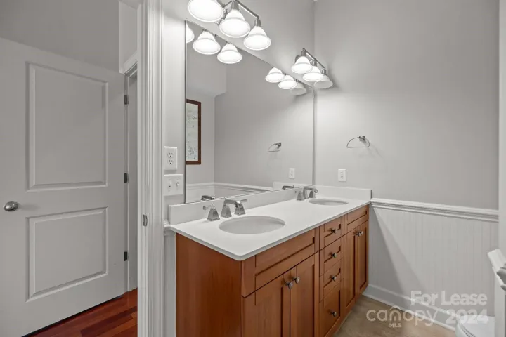 Spacious primary bedroom with dual vanity sink