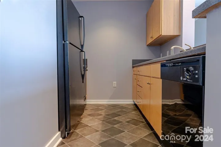 Breakfast bar and kitchen are immediately off the living area. Great area to enjoy your meal and the city views.