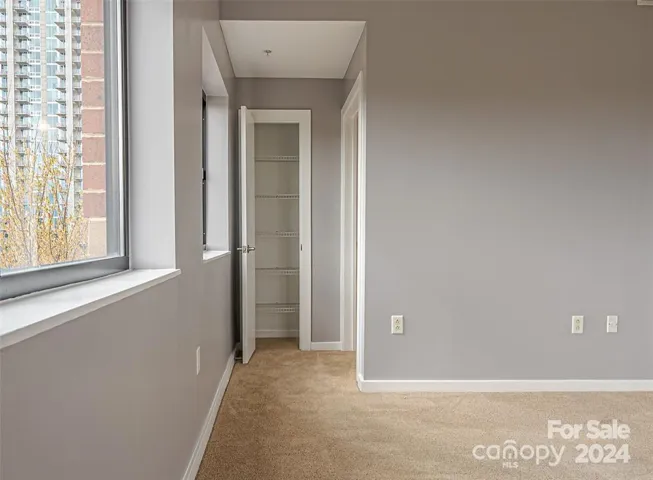 Entry to the primary bathroom, with more storage space for linens, etc.