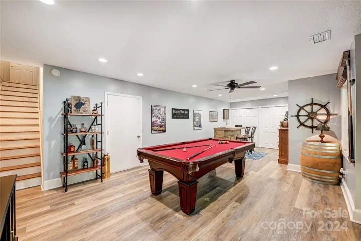 Lower level boasts a versatile rec room, perfect for entertaining or using as an office, exercise space, media room, or playroom