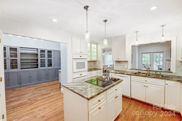 Chef's kitchen opens to breakfast room, currently being used as butlers pantry