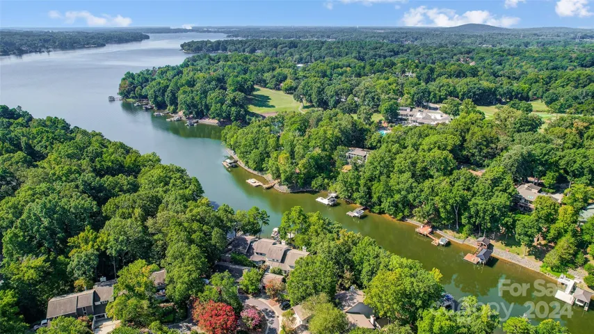 Enjoy picturesque lake views from this waterfront townhome located on a serene cove opening up to the main channel of Lake Wylie, ideal for swimming, fishing and boating!