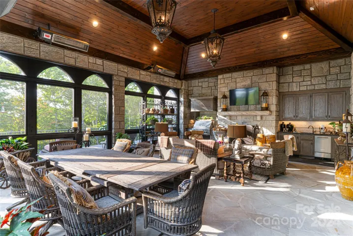 Incredible screened in porch with kitchen area