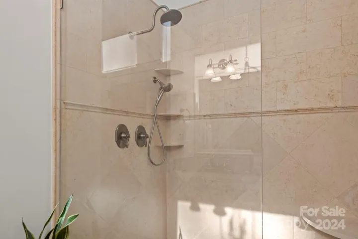 An oversized Tiel shower with built in shelf