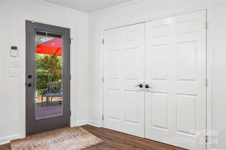 The kitchen has a private door that leads to the deck, perfect for grilling