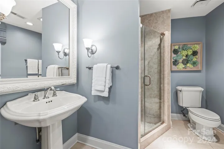 A nicely sized tile shower is another feature here. This space makes this an ideal guest suite