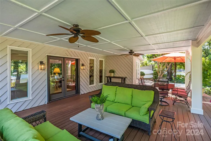 The covered deck expands the length of the home, blending the outdoor and indoor space seamlessly