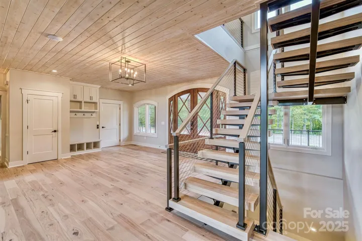Large bright foyer with drop zone and elevator access door.
