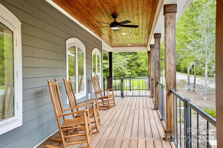 ~ Extra deep front and back porches with composite decking, porch swing/bed, rocking chairs, dining table, fire ring, sectional sofa, and metal roofs for relaxing during summer showers