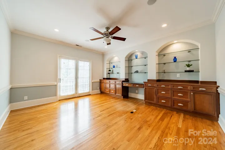 Upstairs office with built ins and Juliet balcony