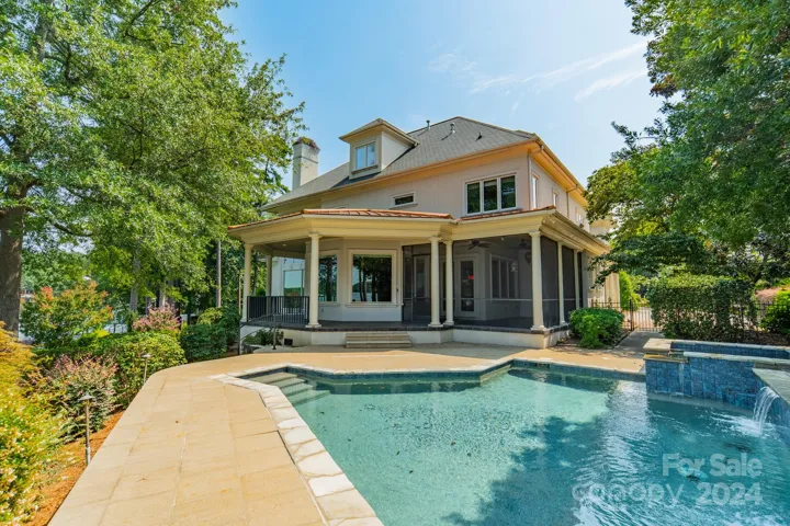 Backyard pool and jacuzzi with wrap around porch and screened in porch
