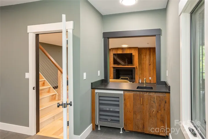 Retro Wet Bar with Beverage Fridge and Laudry Room.