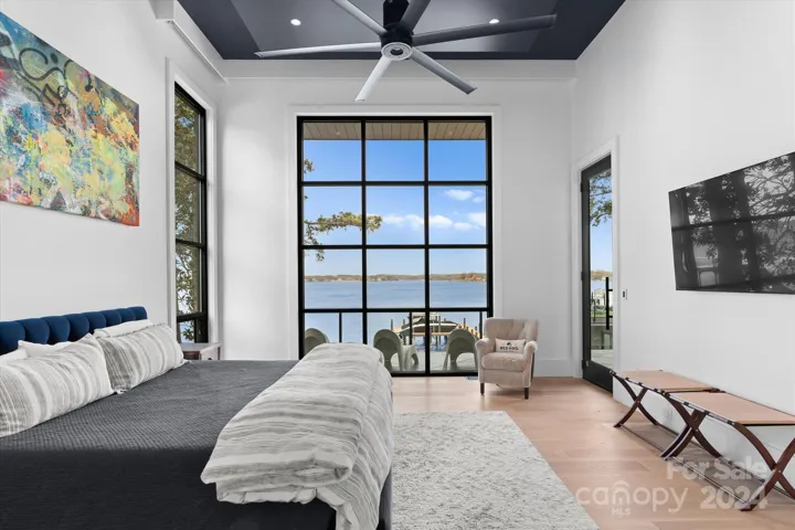 The primary bedroom opens directly to a private outdoor terrace, offering a serene retreat and effortless indoor-outdoor living.